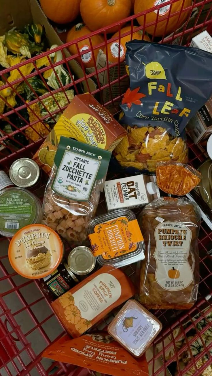 A Trader Joe's shopping cart is full of seasonal groceries